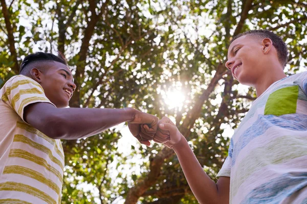 African And Caucasian Boys Joining Hands Against Racism — Stock Photo, Image