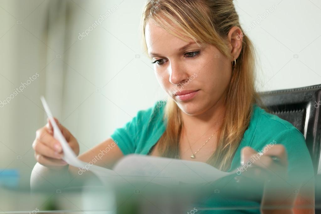 Young woman female student studying at home