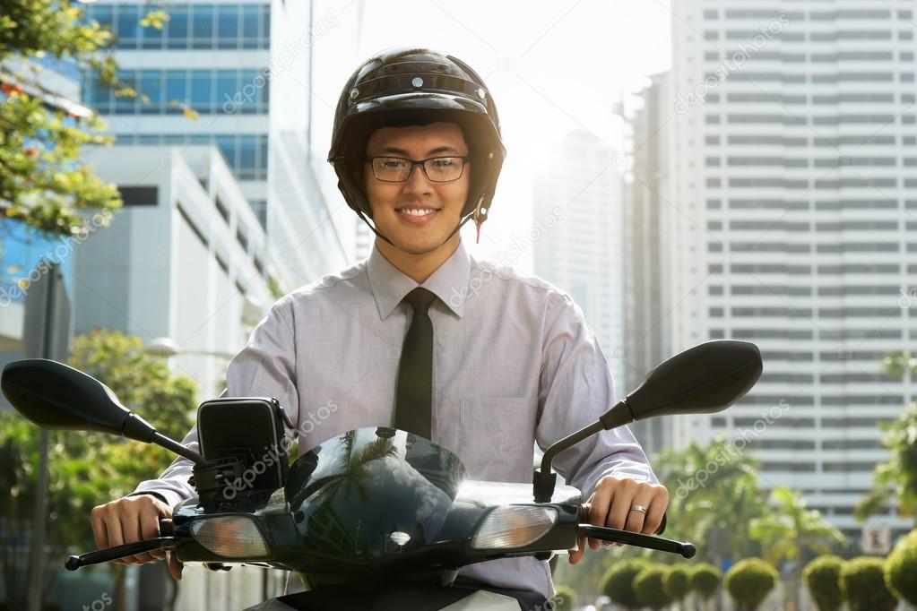 Chinese Businessman Commuter Using Scooter Motorcycle In City