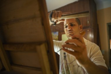 Sculptor Painter Artist Chiseling A Wooden Bas Relief-3