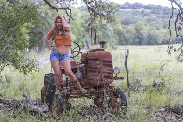 Brunette Model With a Tractor