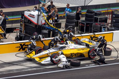JOSEF NEWGARDEN (2) of the United States brings his car in for service during the Big Machine Spiked Coolers Grand Prix at Indianapolis Motor Speedway in Indianapolis Indiana. clipart