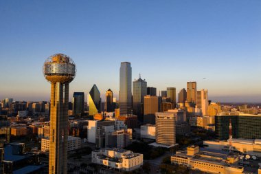 Aerial view of Dallas shows a vast, vibrant metropolis with its iconic skyline, sweeping highways, and sprawling suburbs, highlighting the DFW region as a major inland hub of industry, transit, and culture.