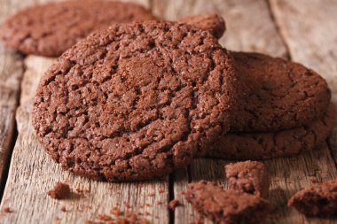 Fresh chocolate cookies with cracks macro on the table. Horizont clipart