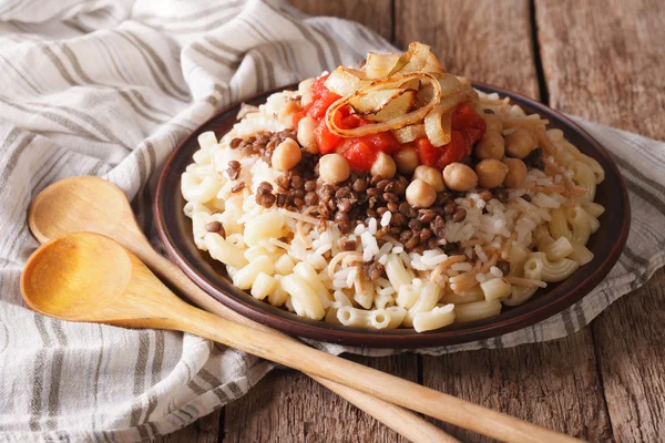 Arabic cuisine: kushari of rice, pasta, chickpeas and lentils cl