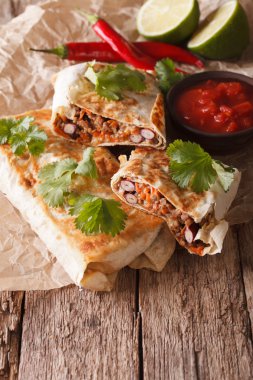 chimichanga with ground meat, beans and cheese macro. Vertical
