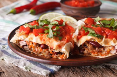 chimichanga with tomato salsa on a plate close-up horizontal