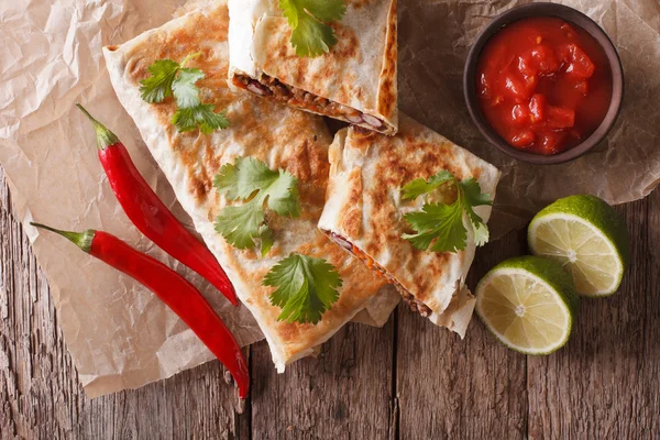 Chimichanga with meat, beans and cheese close-up. Horizontal top — Stock Photo, Image
