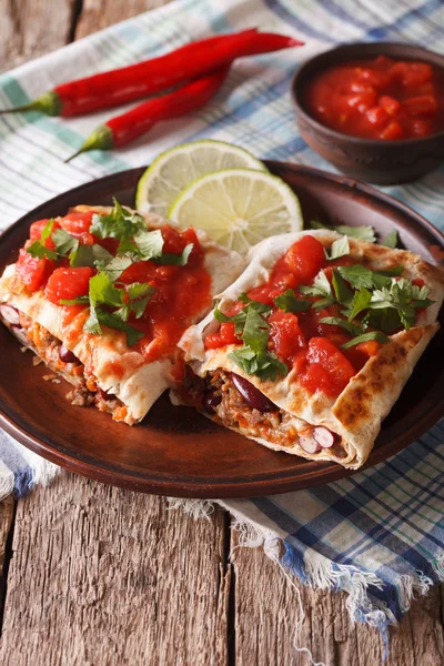 Chimichanga with ground meat, beans and cheese close-up. Vertica — Φωτογραφία Αρχείου