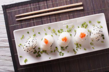 Onigiri rice balls close-up on a plate. Horizontal  top view