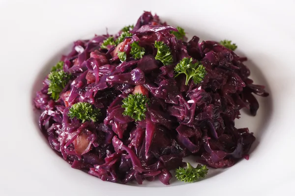 stock image spicy braised red cabbage close-up on a plate. horizontal