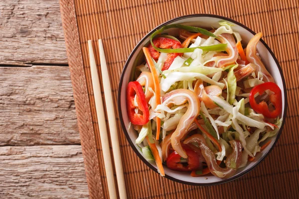 Asian pork ears salad with vegetables on the table. horizontal t — Stockfoto