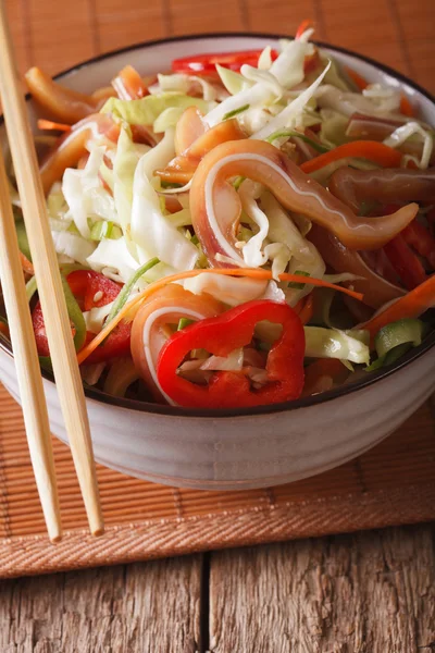 Asian cuisine: pork ears salad with fresh vegetables close-up. v — Stock Photo, Image