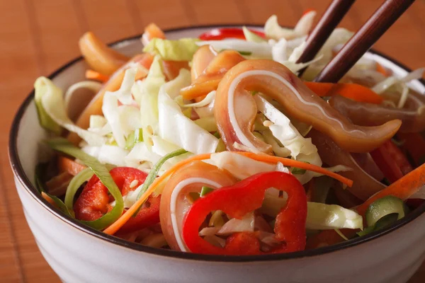 Salad with pig ears and vegetables in a bowl macro. Horizontal — Stock Photo, Image