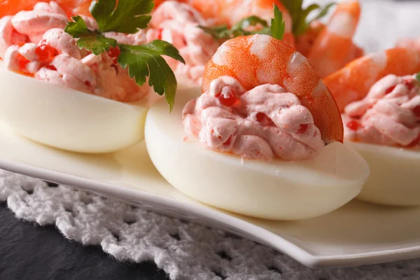 Eggs stuffed with shrimp, cream cheese and caviar closeup. horiz — Stock Photo, Image