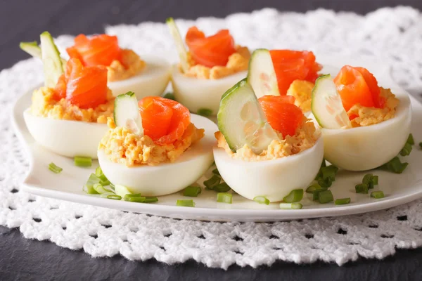 Eggs stuffed with salmon close-up on a plate. horizontal — Stock Photo, Image