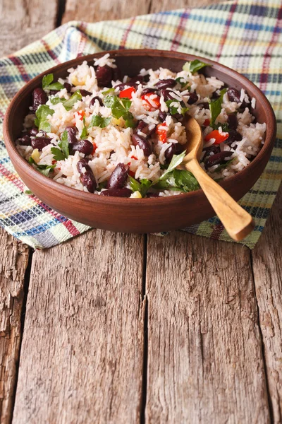 Rice with red beans and other vegetables in a bowl. vertical — Stok fotoğraf