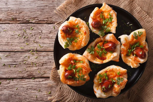 Muffins stuffed with sausage and cheese on a plate. horizontal t — Stock Photo, Image