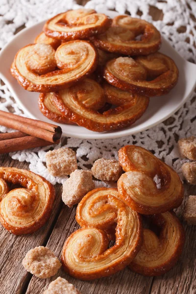 Tasty cookies Palmiers with sugar and cinnamon close-up, vertica — Stock Photo, Image