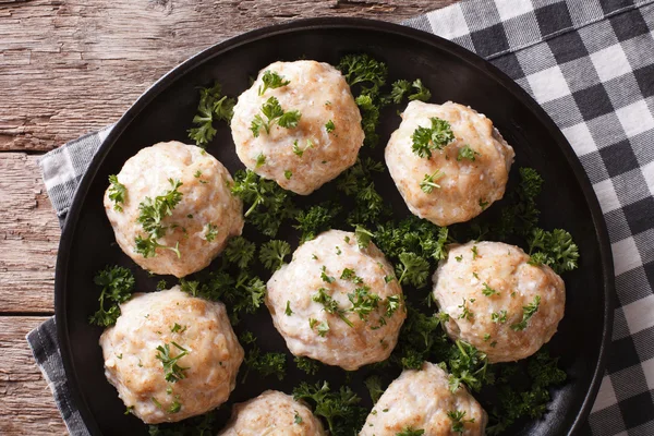 Steamed meatballs with parsley on the table. horizontal top view — Stock Photo, Image
