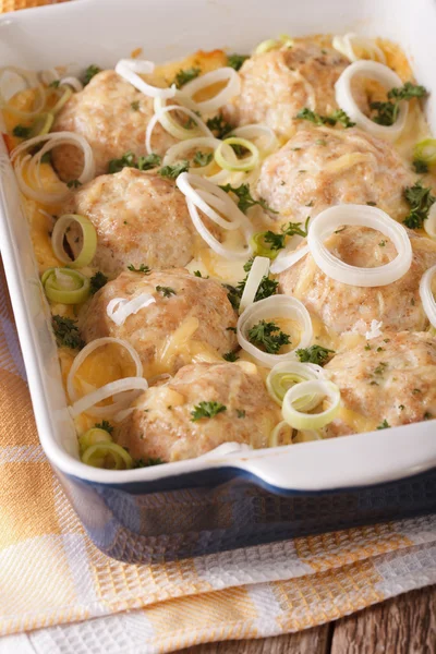 Chicken burgers with cheese and onions closeup in baking dish. v — Stock Photo, Image