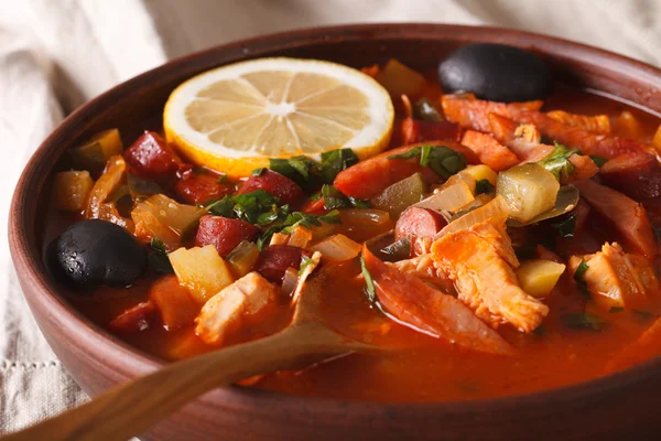 Solyanka - Russian meat soup in bowl macro horizontal — Stock Photo, Image