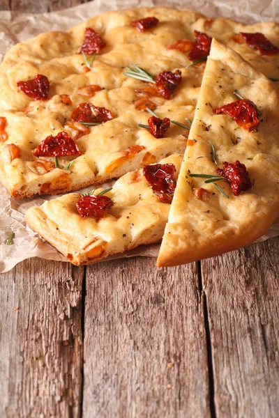Italian focaccia with sun-dried tomatoes and rosemary close up. — Stock Photo, Image