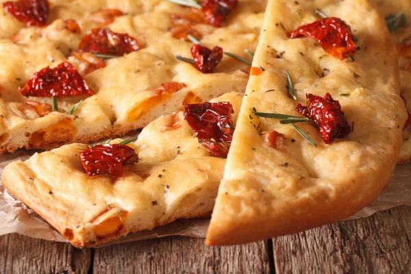 Sliced Italian focaccia with dried tomatoes. macro horizontal — Stock Photo, Image