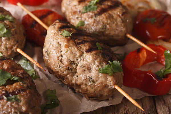 Homemade Kofta kebab with grilled vegetables on a table macro. H — Stock Photo, Image