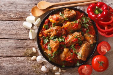 Chakhokhbili chicken stew with vegetables on the table. horizont clipart
