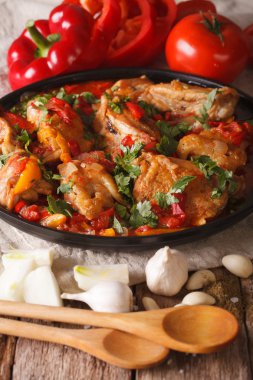 Georgian cuisine: chicken stew with vegetables close-up. vertica clipart