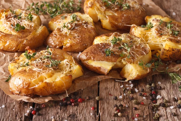 Tasty hot baked new potato with thyme close-up. horizontal — Stock Photo, Image