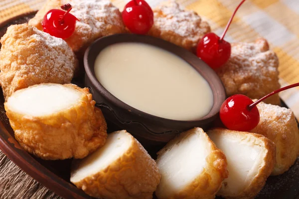 Leche frita with condensed milk and cherries macro. horizontal — Stock Photo, Image