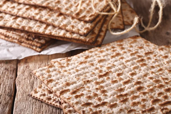 Jewish kosher matzah macro on a table. horizontal — Stock Photo, Image