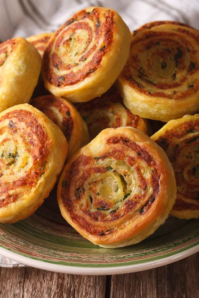 Indian potato roll Alupatry macro on a plate. Vertical — Stock Photo, Image