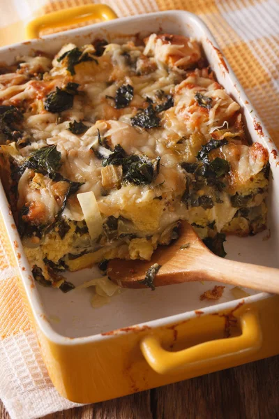 Strata casserole with spinach close up. vertical — Stock Photo, Image