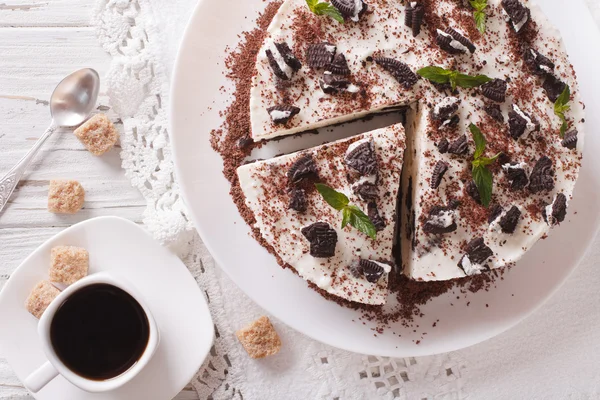 Cheesecake dessert with chocolate and coffee on a table close-up — Stock Photo, Image