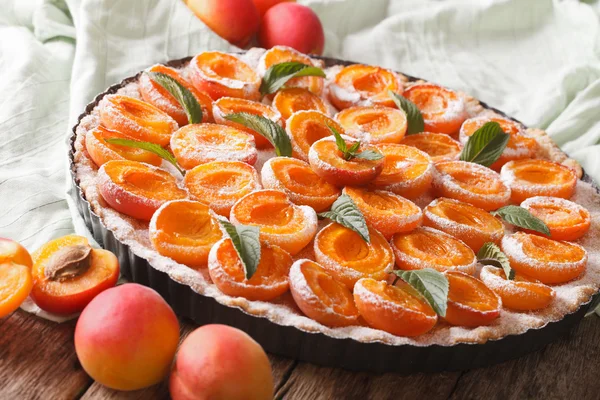 Apricot tart close up in baking dish. horizontal — Stock Photo, Image