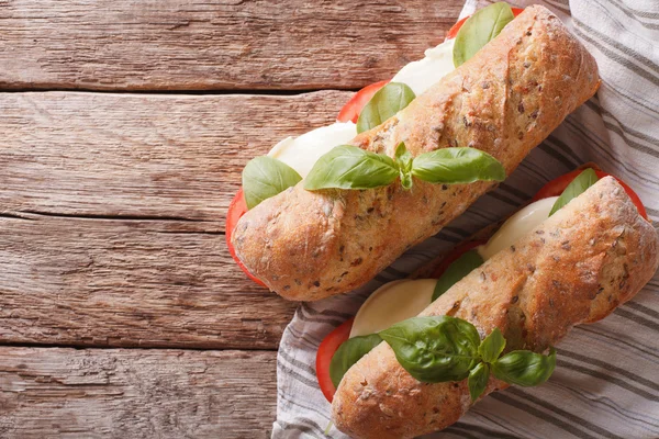 Italian caprese sandwich macro on the table. horizontal top view — Stock Photo, Image