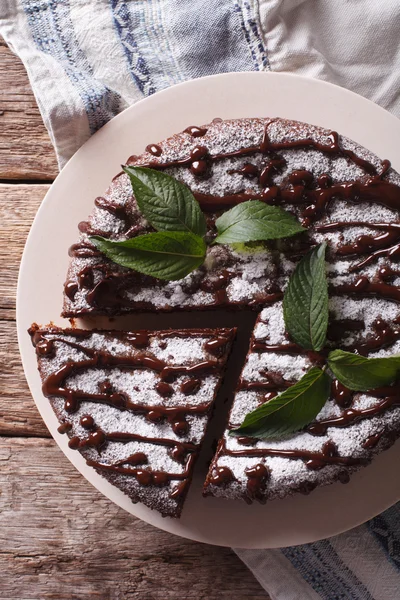 Freshly baked pie with poppy seeds and powdered sugar and mint c — Stock Photo, Image