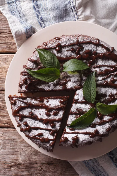 Freshly baked pie with poppy seeds and powdered sugar and mint c