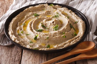 Middle Eastern cuisine: baba ghanoush closeup in a plate. horizo clipart