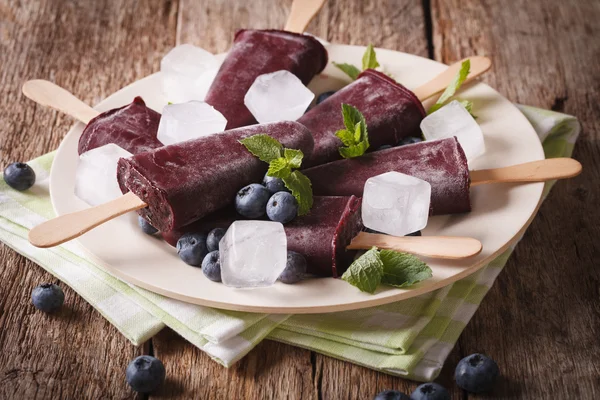 Homemade Blueberry ice cream on a stick closeup on on the table. — Stock Photo, Image