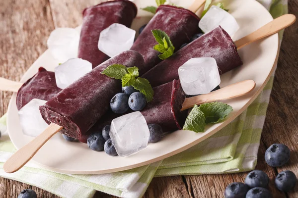 Blueberry fruit ice lolly close up on the table. horizontal — Stock Photo, Image