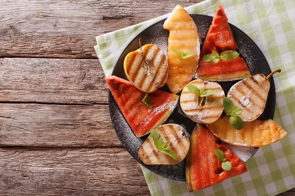Watermelon, pear, apple and melon grilled close-up. horizontal t — Stock Photo, Image