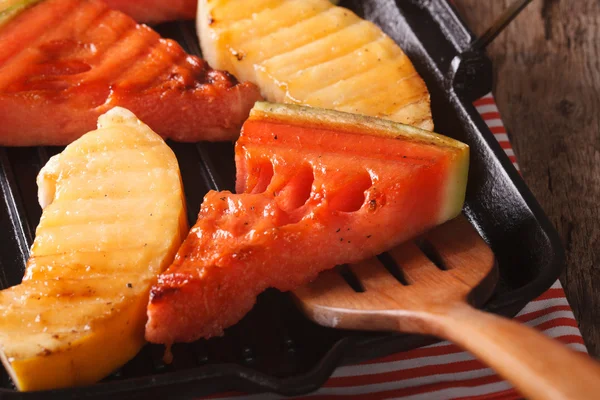 Watermelon and melon in a pan grill macro. horizontal — Stock Photo, Image