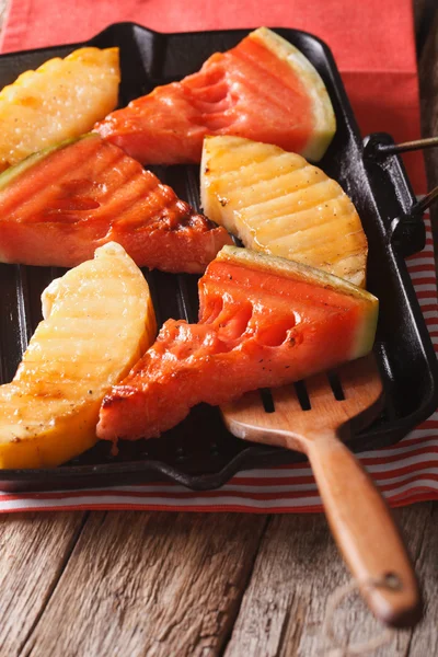 Grilled Watermelon and melon in a pan grill close-up. vertical — Stock Photo, Image