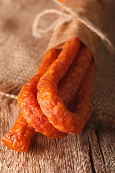 Sausage or kabanos macro on vintage wooden boards — Stock Photo, Image