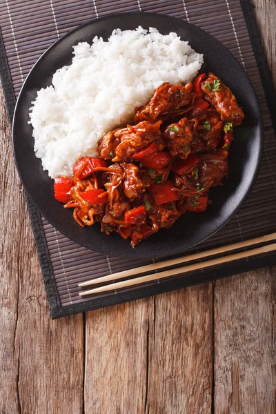 Chinese food: pork in sweet and sour sauce with rice close-up. V — Stock Photo, Image