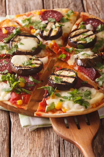 Pizza with eggplant, salami, corn and mozzarella close up. verti — Stock Photo, Image